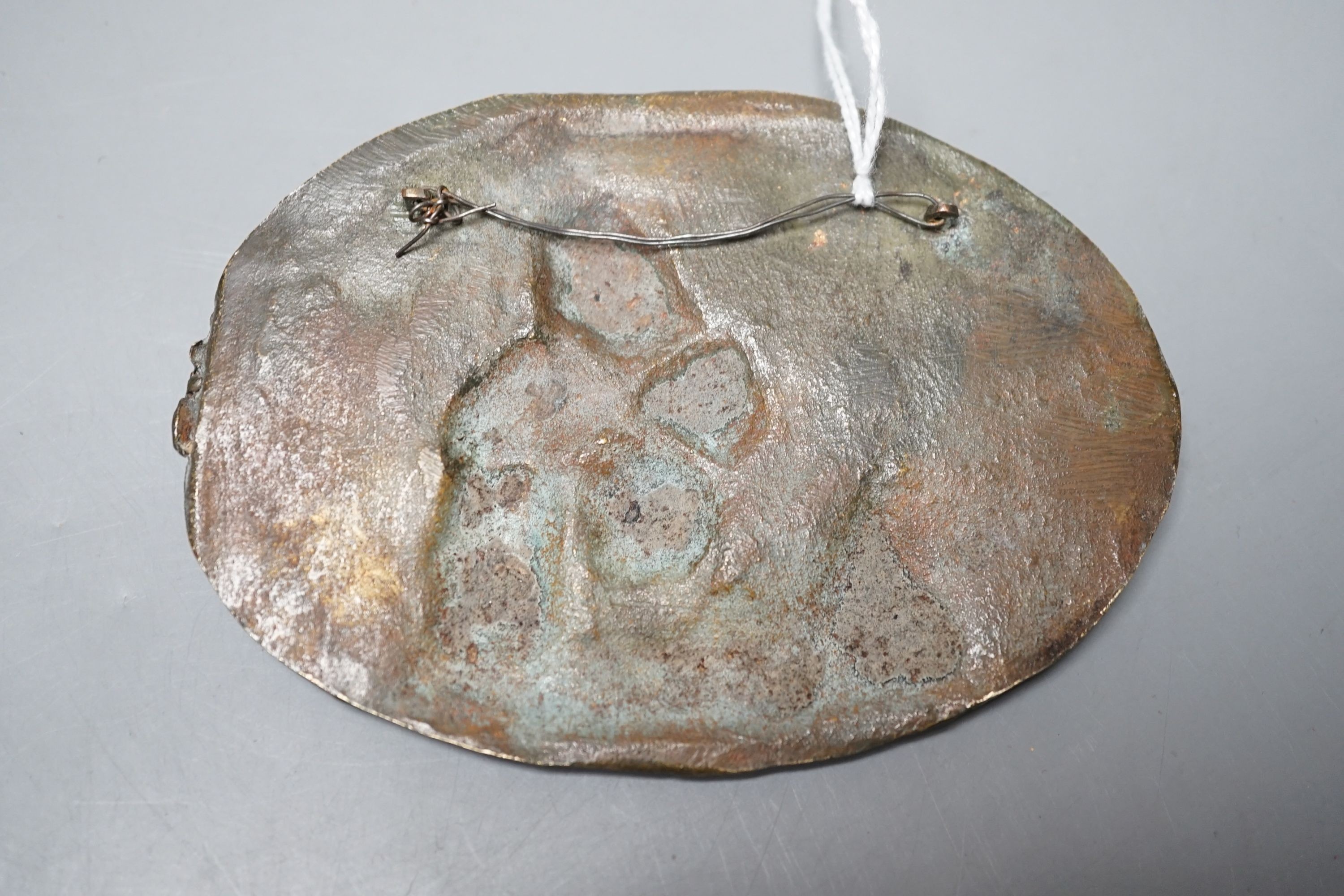 A Renaissance or later bronze 'astronomy' cherub plaque 11.5cm